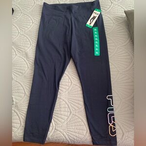 Woman’s Fila multicolored logo high waist Leggings. W/tags. Fit like a Large